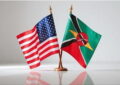 Image of United States and Kenya flag on a table desk
