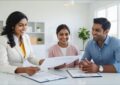 Image of a female mortgage broker showing documents to a happy home buyer