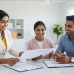 Image of a female mortgage broker showing documents to a happy home buyer